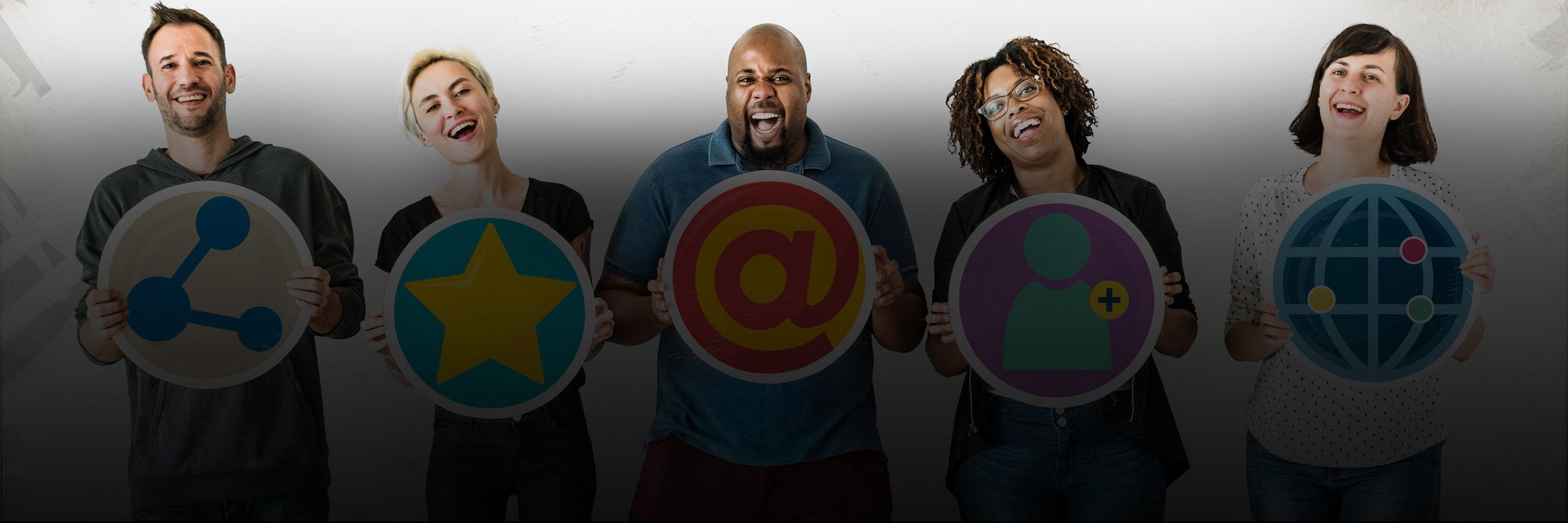 A group of diverse people showcasing different social media icons, representing unity in digital connectivity and engagement with All In Adventures.